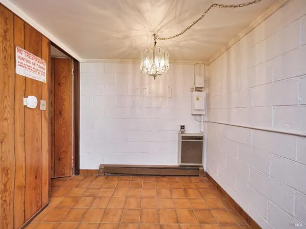 a view of a room that has a bed and a window