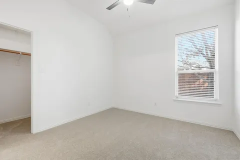 an empty room with a bathroom