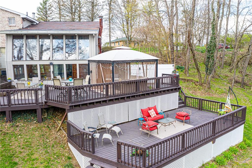 110 Sturm Lane Rochester, PA 15074 - Photo 22 of 24 Large two tier deck right off the sunroom. The canopy stays! An entertainer's dream.