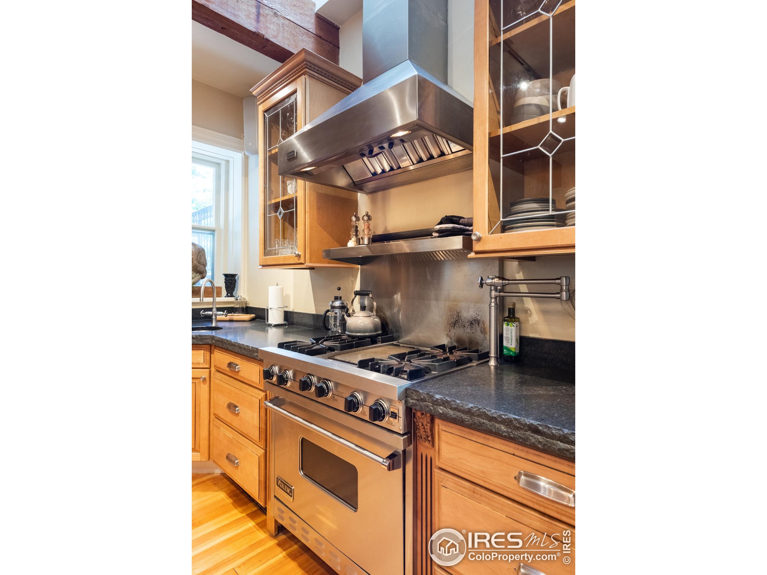 643 Mapleton Avenue Boulder, CO 80304 - Photo 13 of 50 a kitchen with stainless steel appliances granite countertop a stove and a microwave