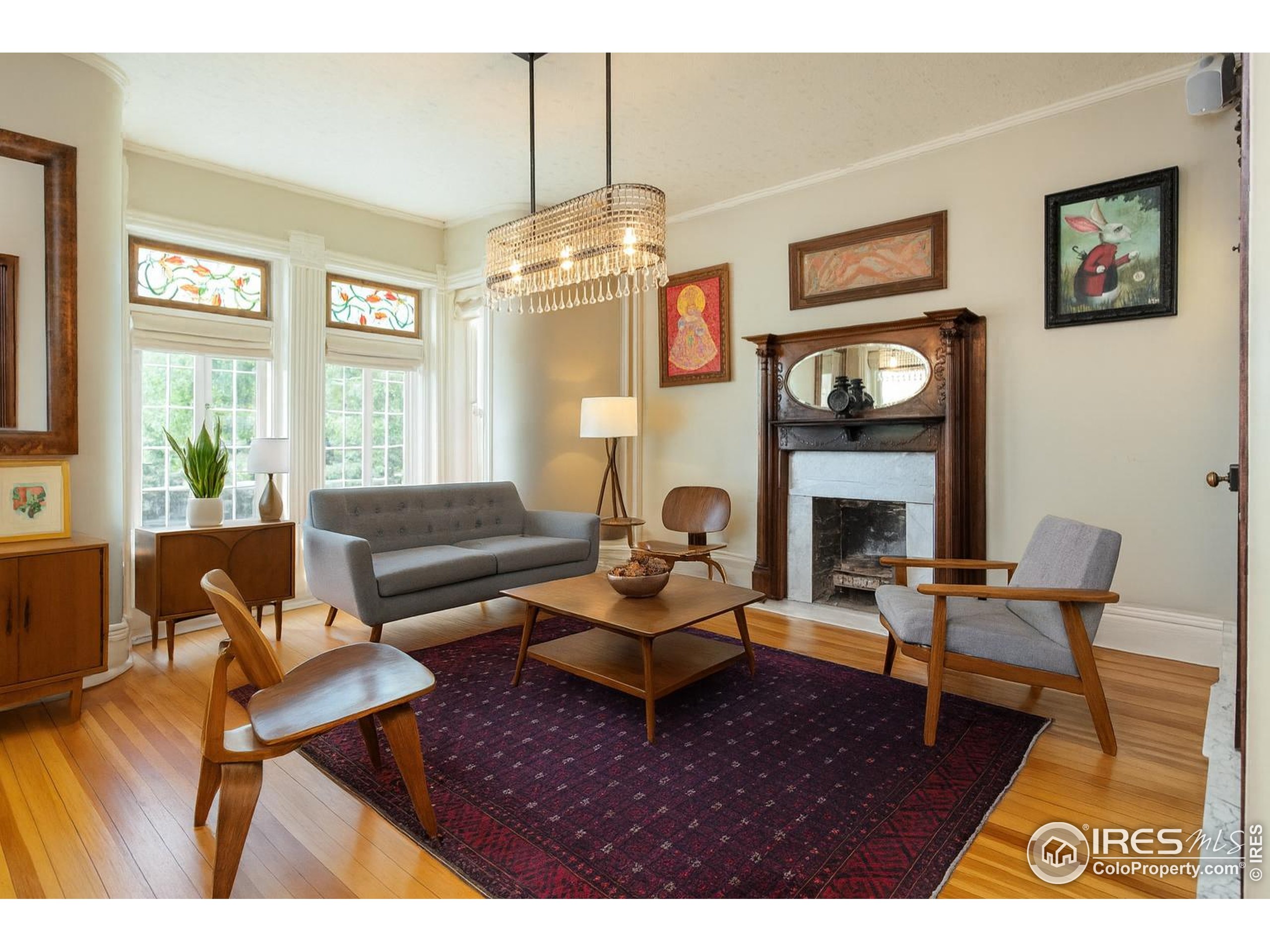 643 Mapleton Avenue Boulder, CO 80304 - Photo 16 of 50 a living room with furniture a window and a fireplace