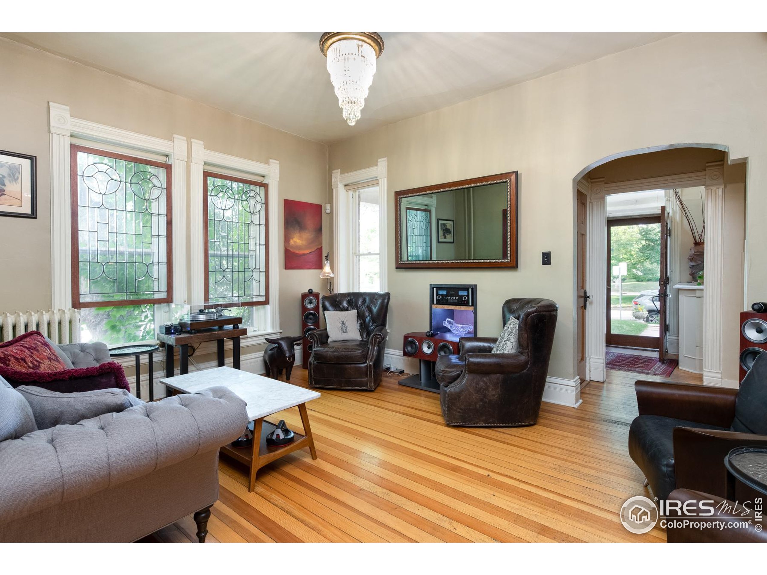 643 Mapleton Avenue Boulder, CO 80304 - Photo 19 of 50 a living room with furniture fireplace and a large window
