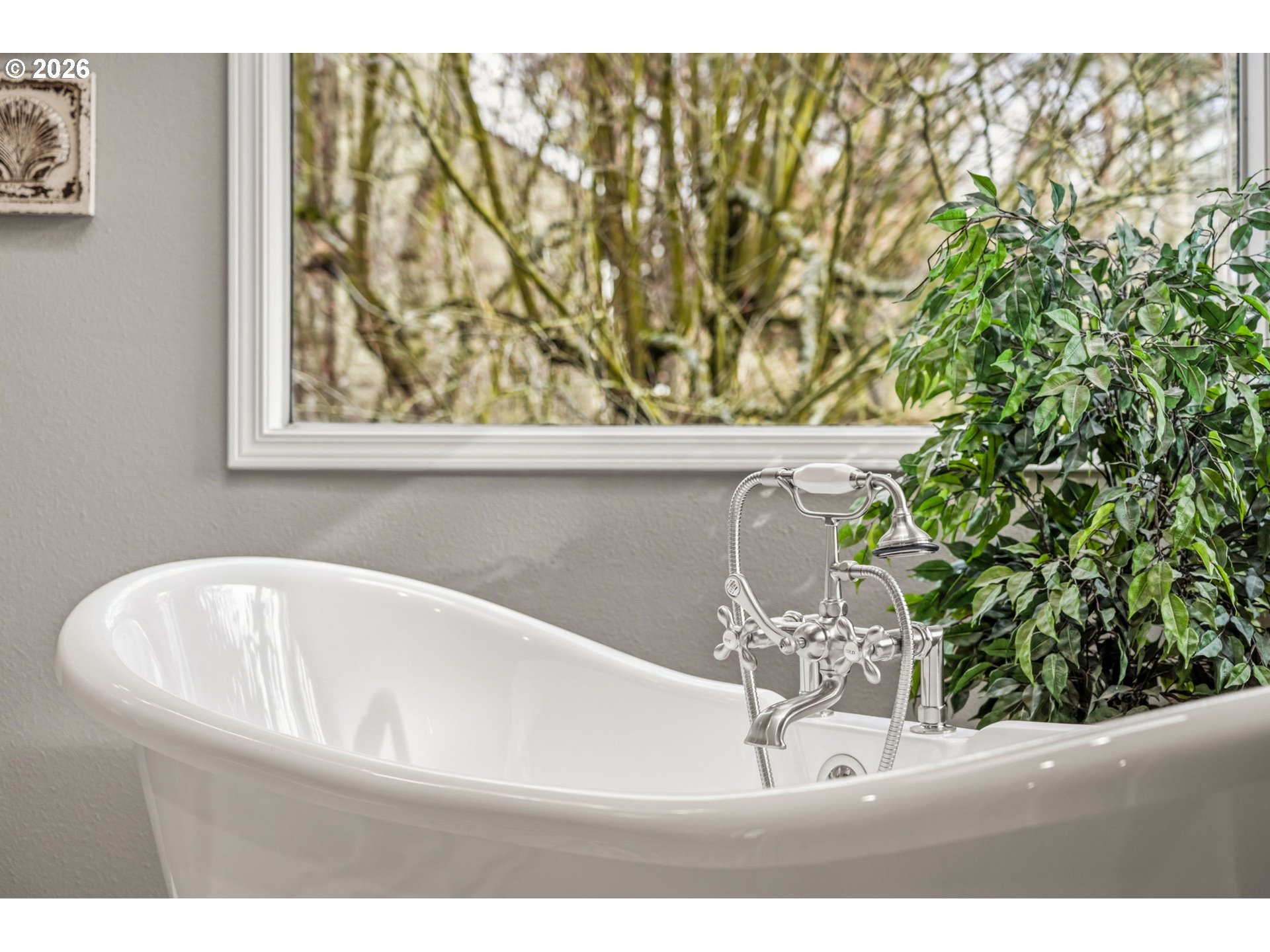 6108 Southwest Kruse Ridge Drive Portland, OR 97219 - Photo 27 of 42 a white bath tub sitting in a bathroom