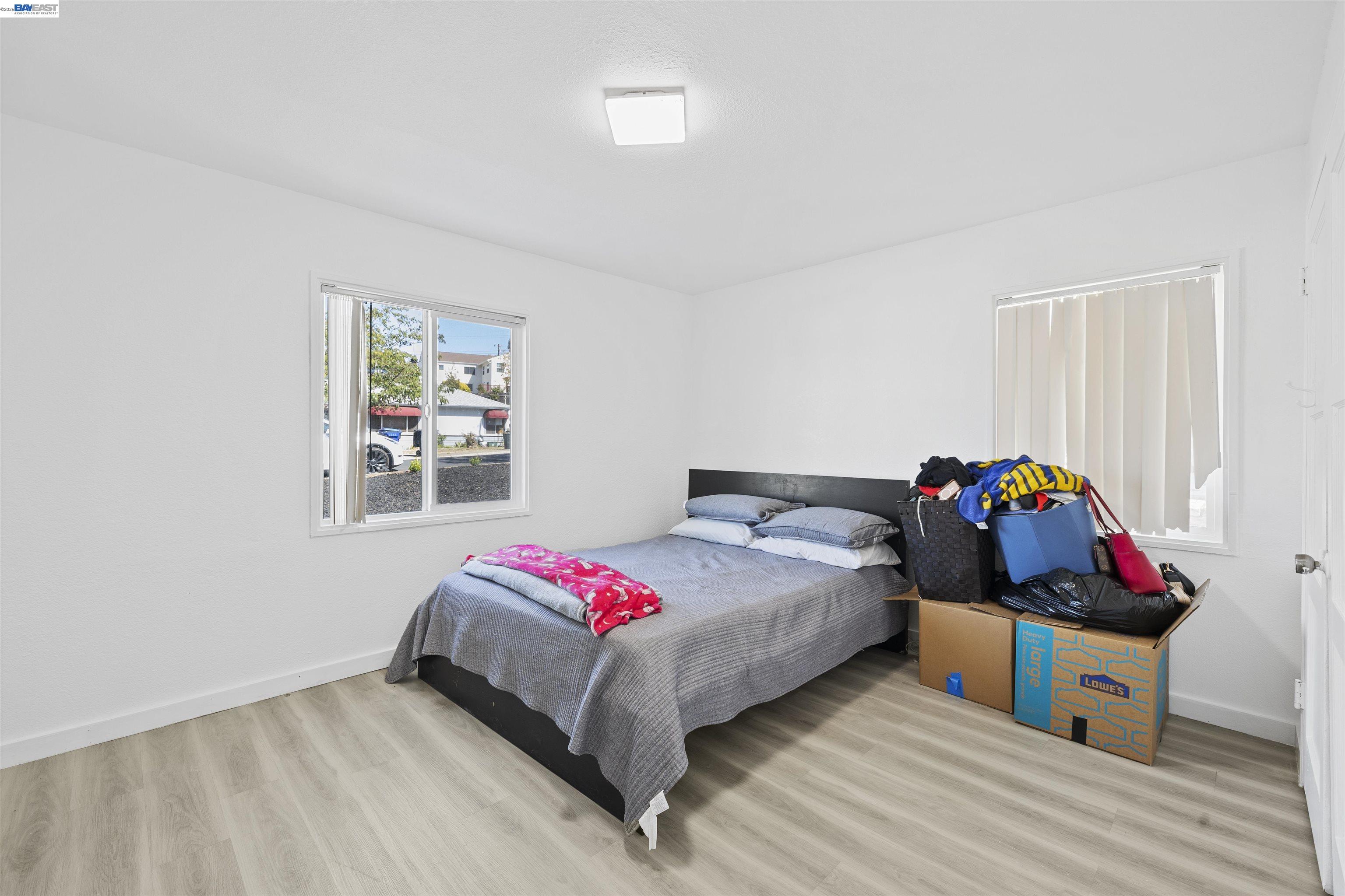 923 Kelvin Road El Sobrante, CA 94803 - Photo 24 of 27 a bedroom with bed and a window