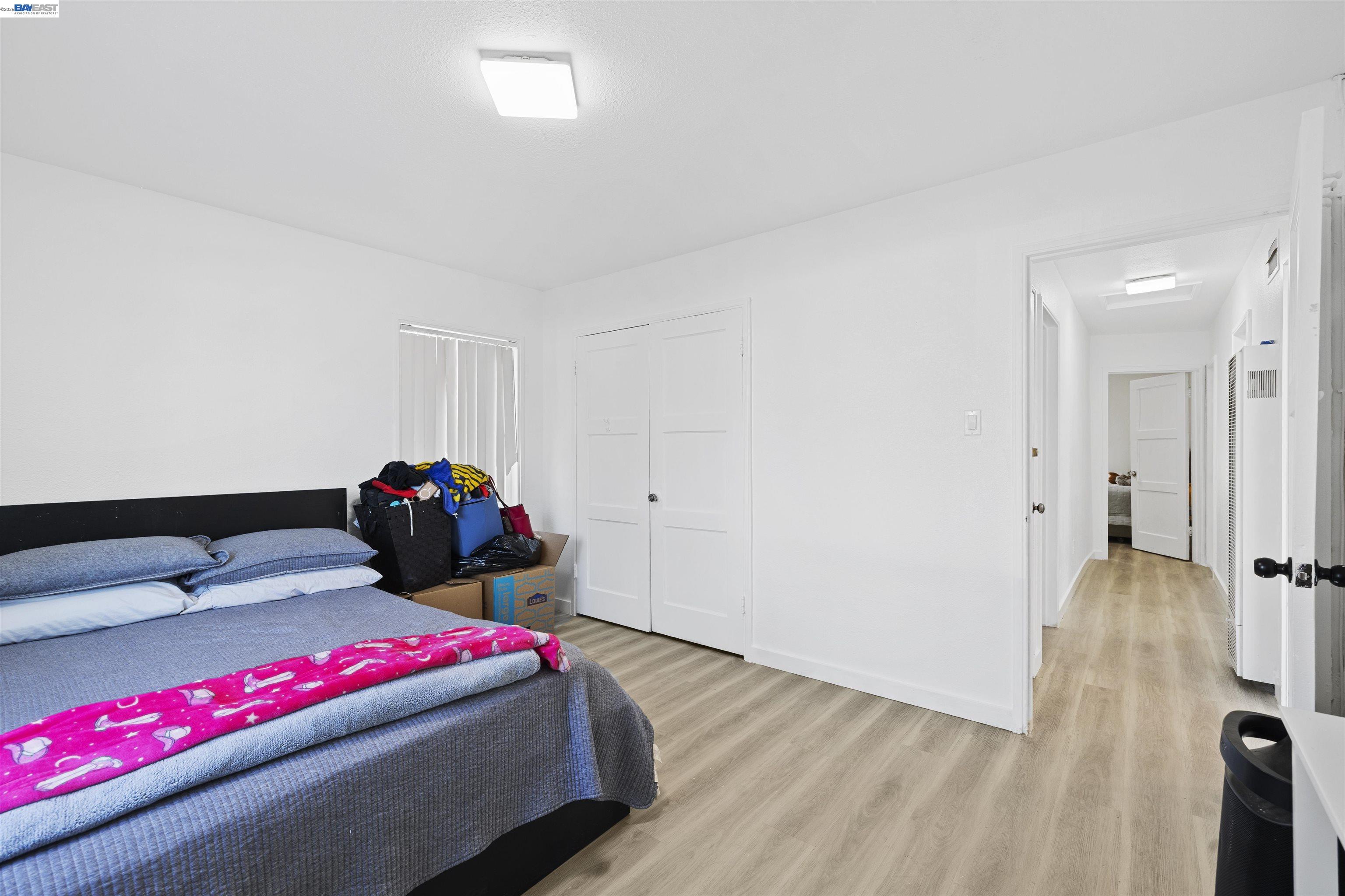 923 Kelvin Road El Sobrante, CA 94803 - Photo 25 of 27 a bedroom with a bed and a potted plant