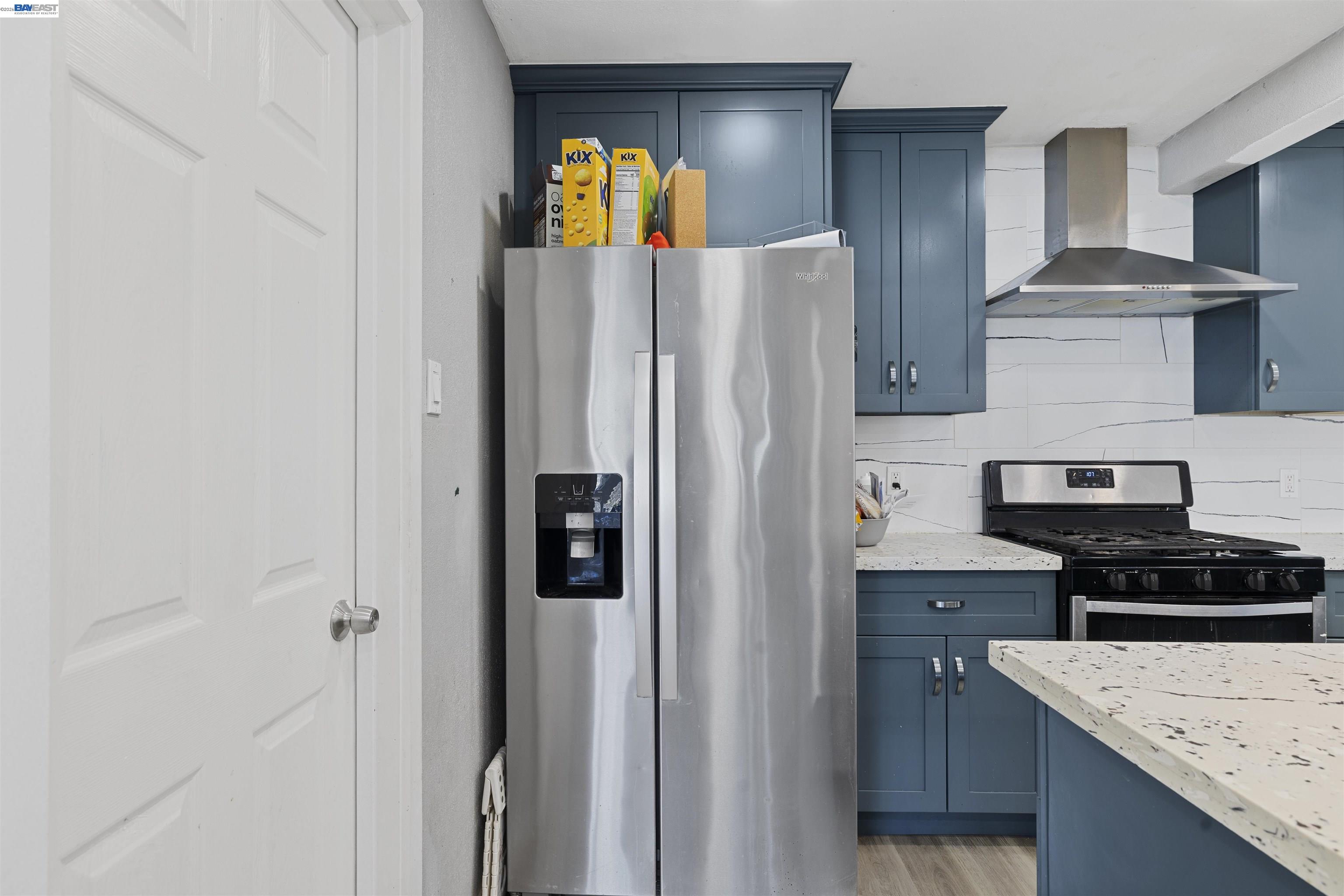 923 Kelvin Road El Sobrante, CA 94803 - Photo 8 of 27 a kitchen with stainless steel appliances granite countertop a refrigerator and a stove top oven