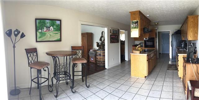 4755 South Qualls Road Adams, TN 37010 - Photo 4 of 20 Spacious kitchen with plenty of cabinets and counter space. Large eat-in kitchen has space for a large family table to look out over the pool area. All appliances remain