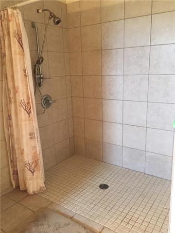 4755 South Qualls Road Adams, TN 37010 - Photo 7 of 20 This walk-in shower is designed to be handicapped accessible.