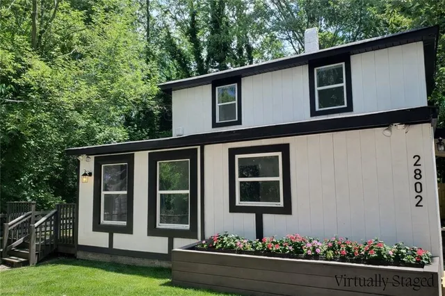 a front view of a house with yard