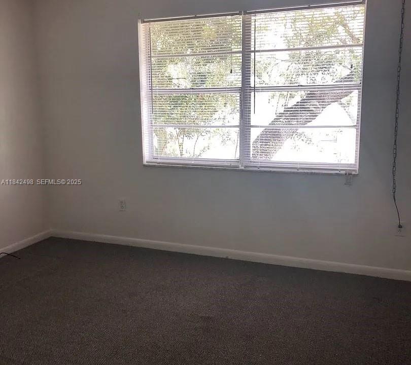 2524 Congress Street, Unit 7 Fort Myers, FL 33901 - Photo 7 of 10 an empty room with a window
