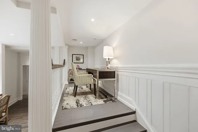 a spacious bedroom with a large bed and a fireplace