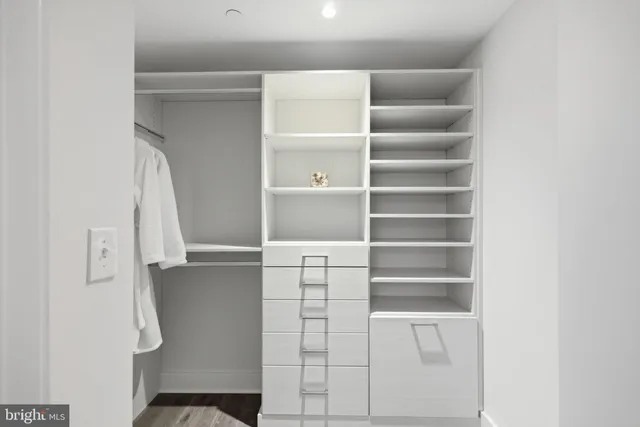 a bedroom with furniture and a wooden floor