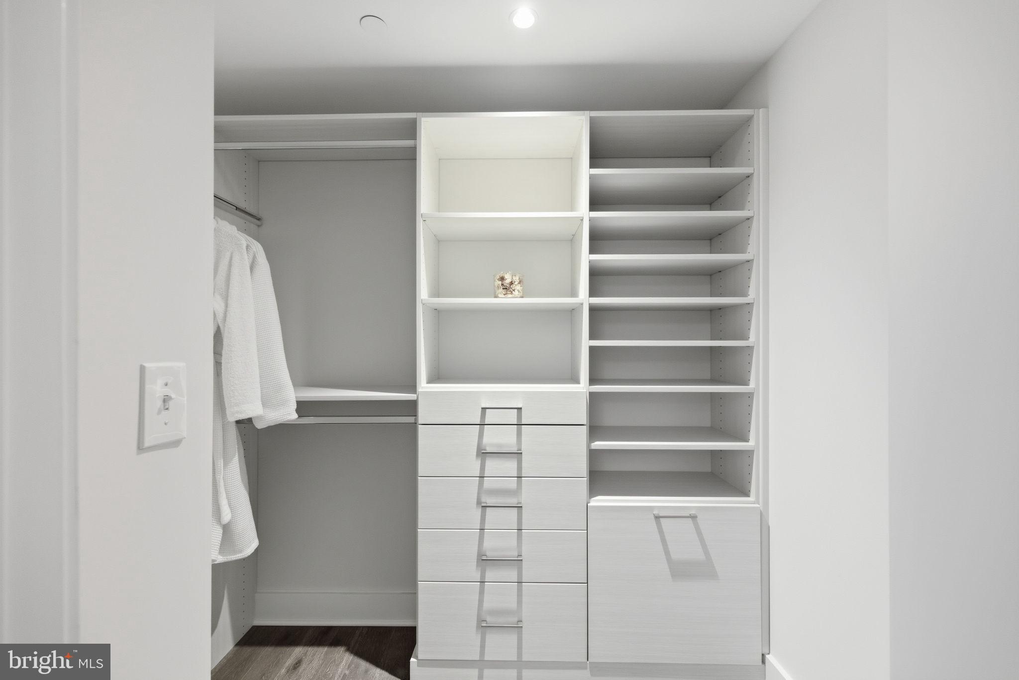 1745 N Street Northwest, Unit 113 Washington, DC 20036 - Photo 15 of 17 a view of walk in closet with empty racks