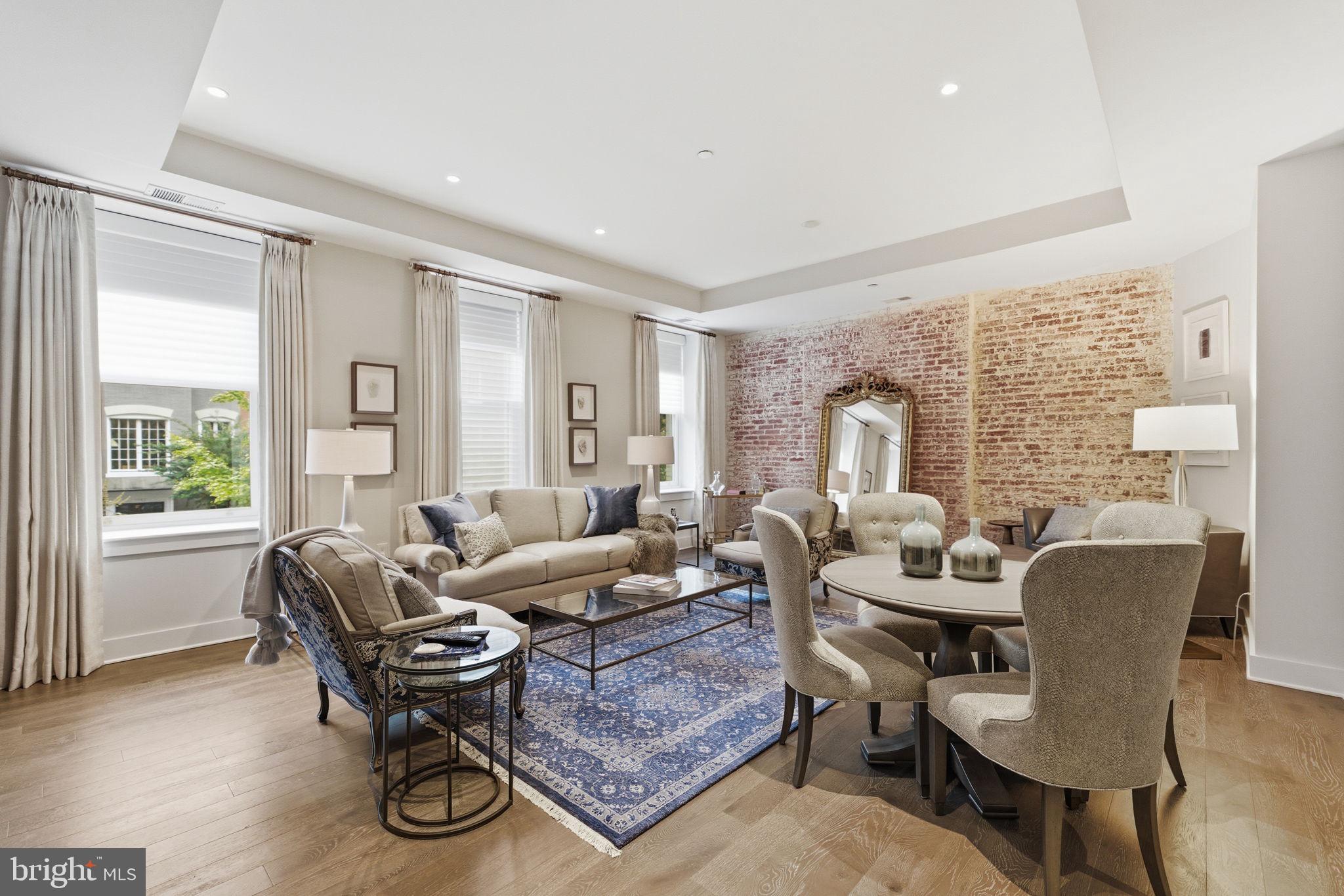 1745 N Street Northwest, Unit 113 Washington, DC 20036 - Photo 2 of 17 a living room with furniture and a window