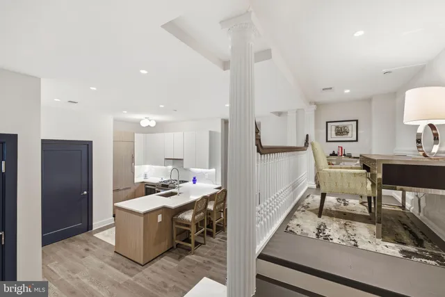a kitchen with stainless steel appliances kitchen island granite countertop a sink and cabinets