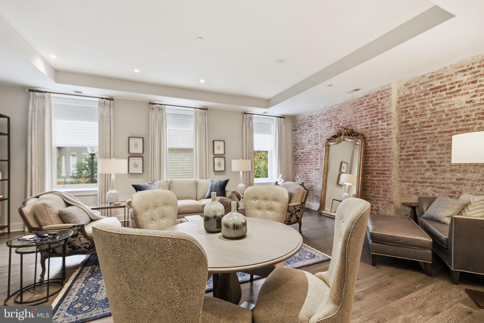 1745 N Street Northwest, Unit 113 Washington, DC 20036 - Photo 6 of 17 a living room with furniture and wooden floor