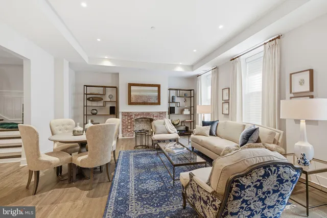 a living room with furniture or couch and a wooden floor