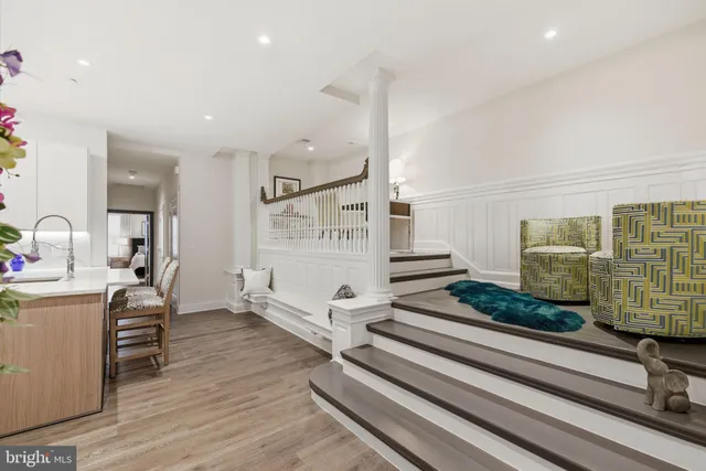 a view of a hallway with seating area