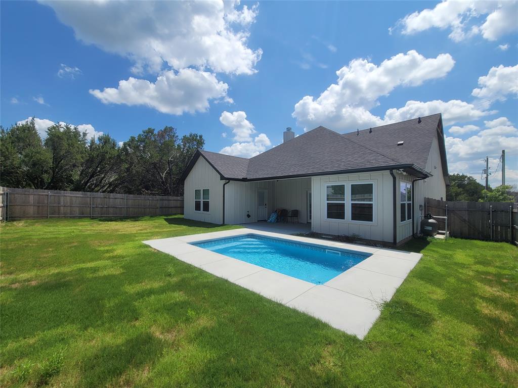 4825 Wichita Street Granbury, TX 76048 - Photo 28 of 30 a view of a house with a backyard