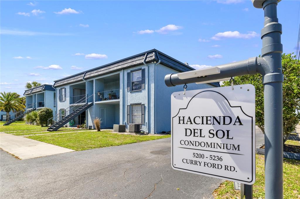 5200 Curry Ford Road, Unit 102 Orlando, FL 32812 - Photo 13 of 23 a sign on the side of a building