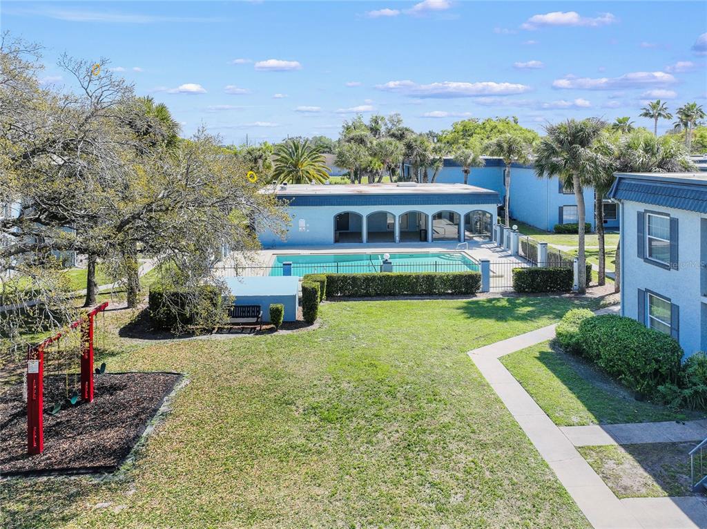 5200 Curry Ford Road, Unit 102 Orlando, FL 32812 - Photo 17 of 23 a view of a backyard with a garden and plants