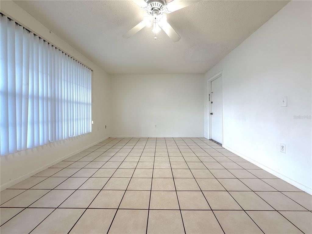 5200 Curry Ford Road, Unit 102 Orlando, FL 32812 - Photo 2 of 23 a view of an empty room and window