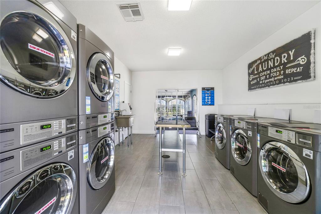 5200 Curry Ford Road, Unit 102 Orlando, FL 32812 - Photo 21 of 23 a view of a storage and utility room with washer and dryer