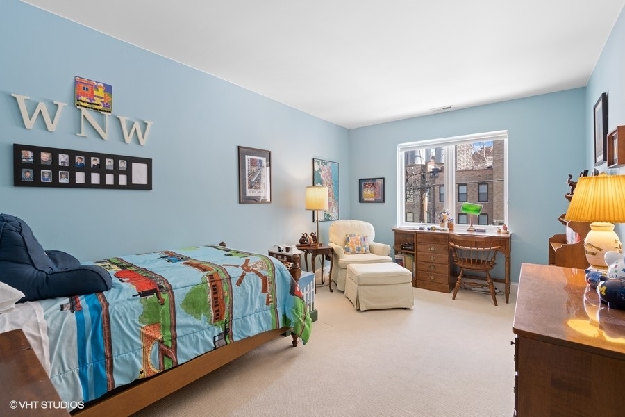 1335 North Sutton Place Chicago, IL 60610 - Photo 16 of 31 a bedroom with a bed and a couch
