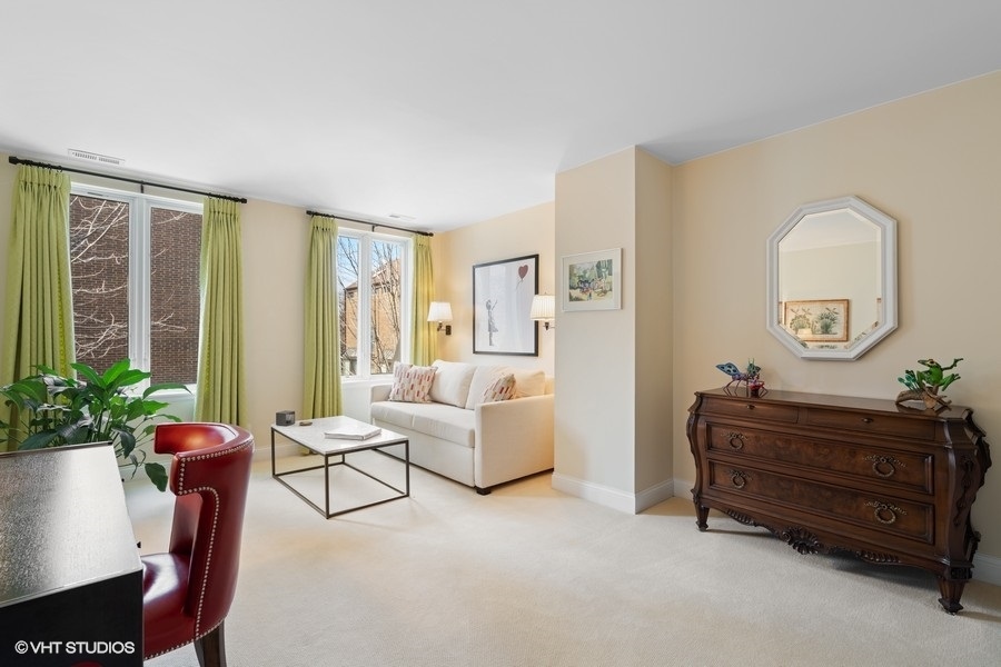 1335 North Sutton Place Chicago, IL 60610 - Photo 17 of 31 a living room with furniture and a potted plant