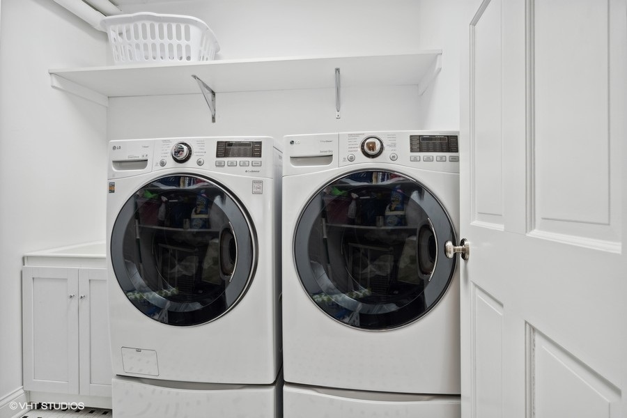 1335 North Sutton Place Chicago, IL 60610 - Photo 21 of 31 a utility room with dryer and washer