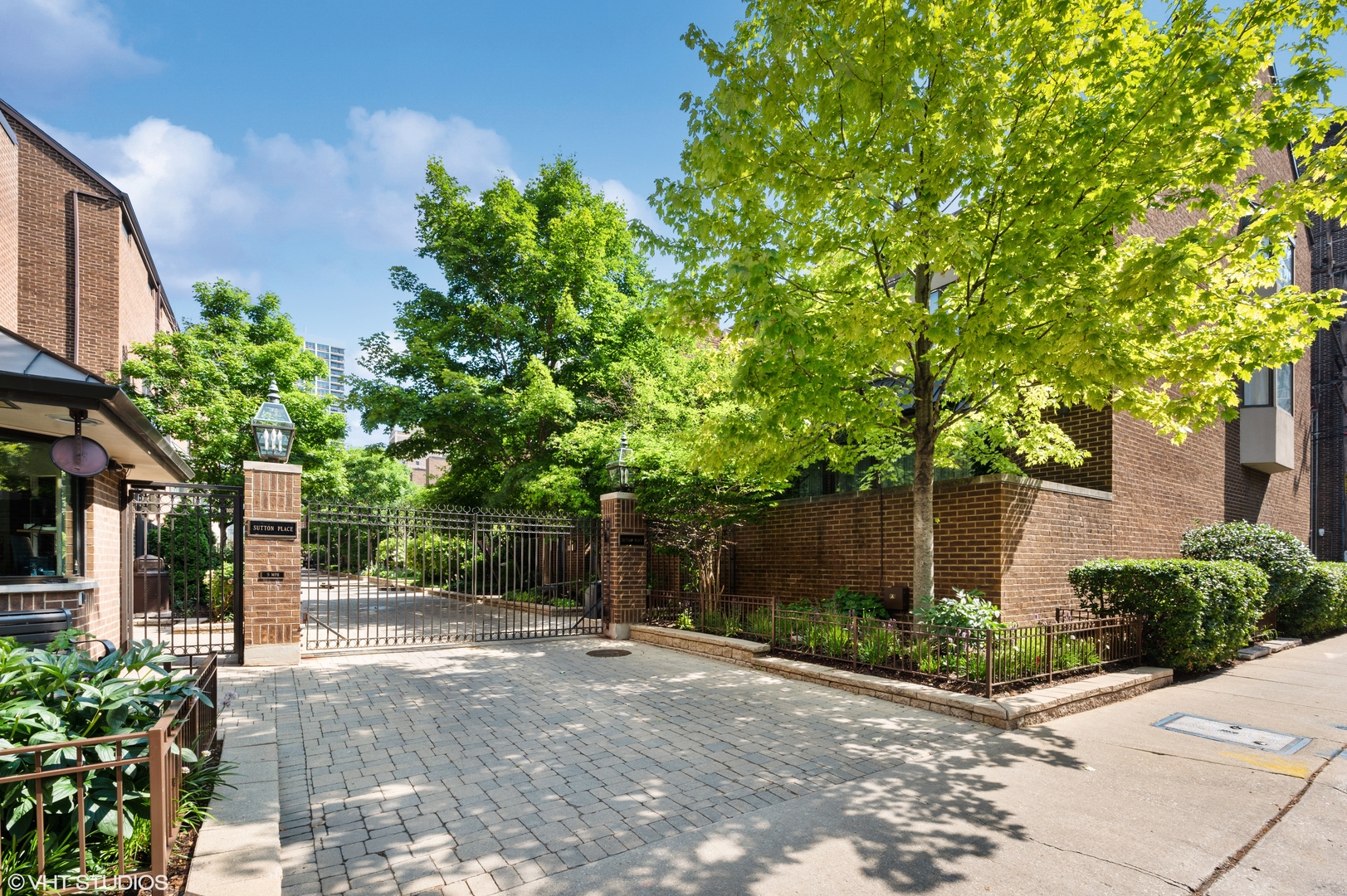 1335 North Sutton Place Chicago, IL 60610 - Photo 26 of 31 a view of a street with plants and trees