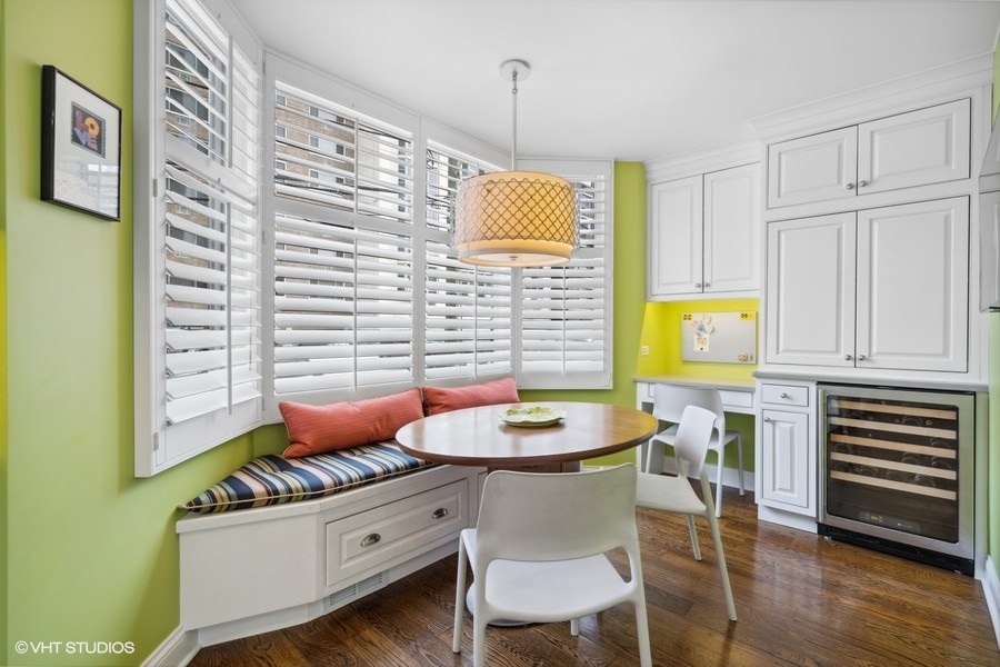 1335 North Sutton Place Chicago, IL 60610 - Photo 6 of 31 a dining room with furniture and wooden floor