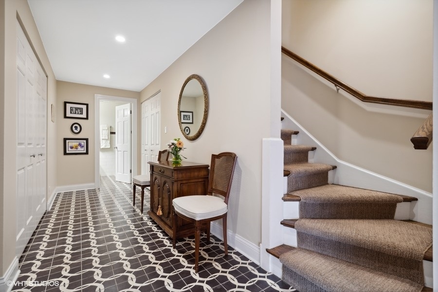 1335 North Sutton Place Chicago, IL 60610 - Photo 10 of 31 a living room with furniture and a rug