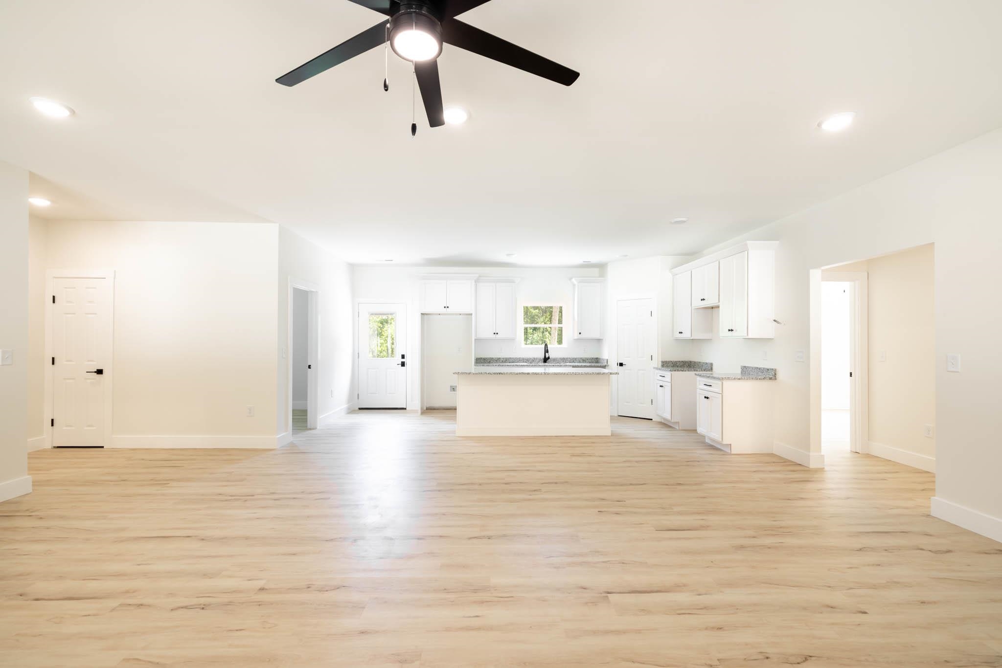 37 William Teague Lane Ramer, TN 38367 - Photo 10 of 39 Spacious living area featuring wood-finish flooring, recessed lighting, and a ceiling fan