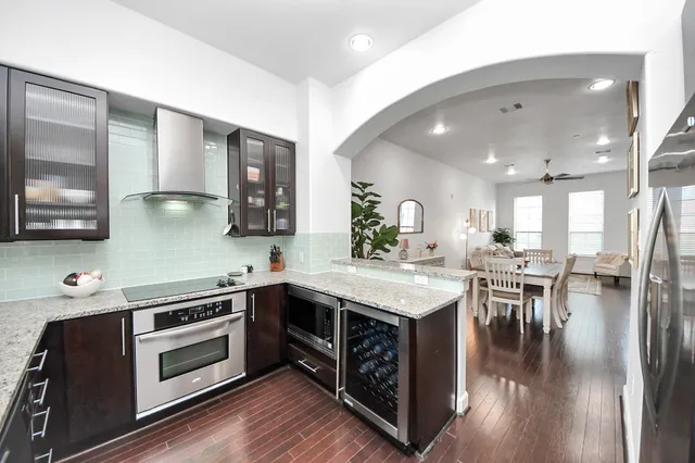 a kitchen with a stove and cabinets