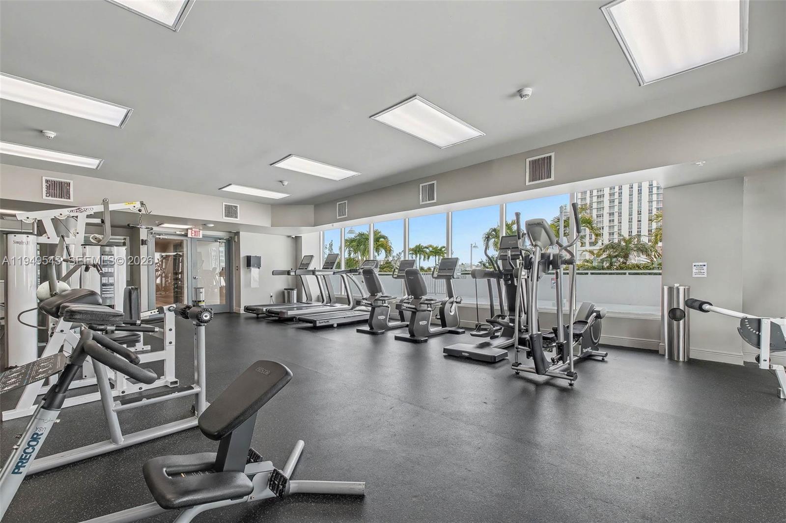 275 Northeast 18th Street, Unit 703 Miami, FL 33132 - Photo 24 of 28 a view of a room with gym equipment