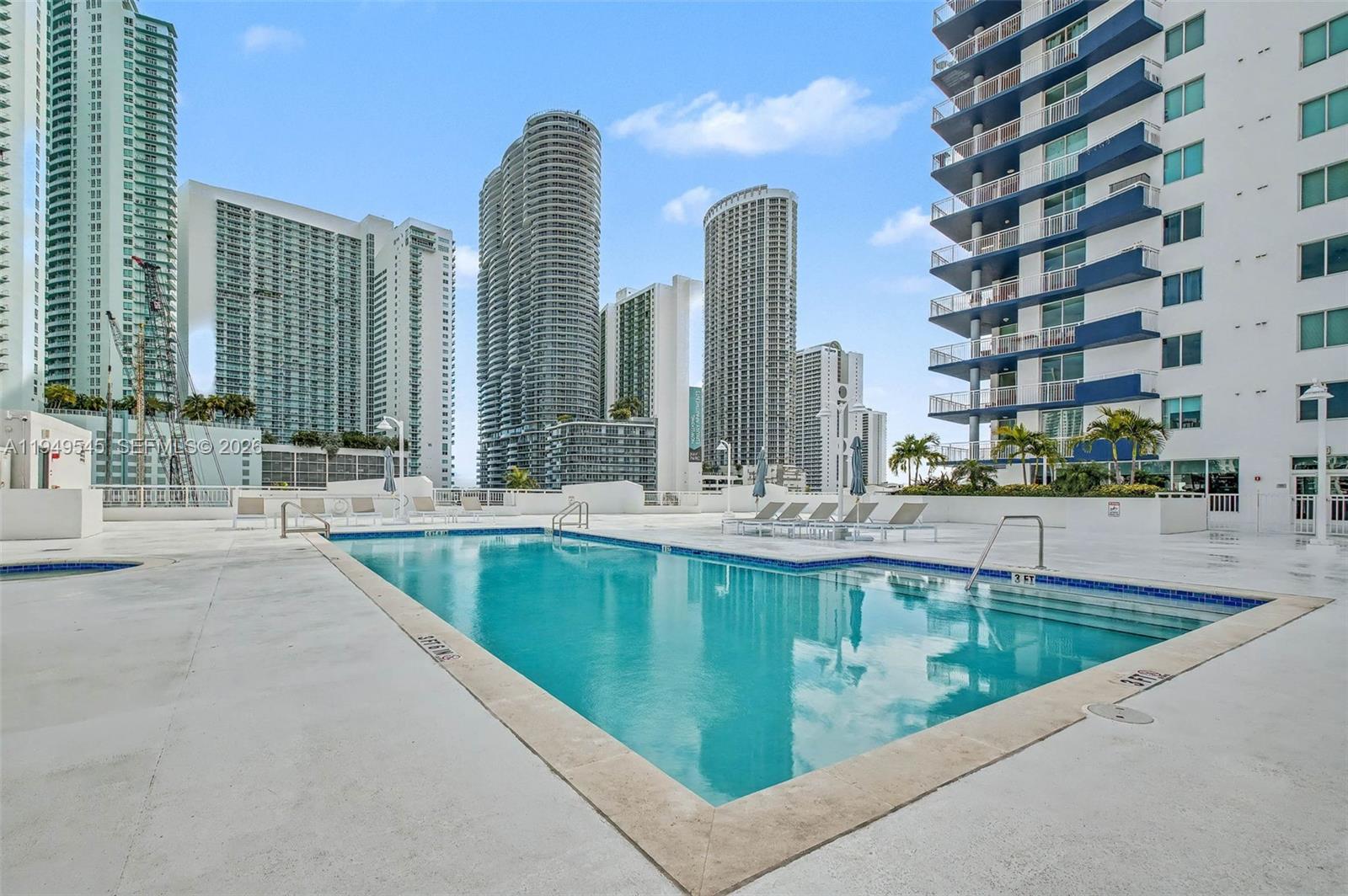 275 Northeast 18th Street, Unit 703 Miami, FL 33132 - Photo 25 of 28 a view of swimming pool from a balcony