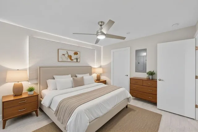 a bedroom with a bed and a dresser