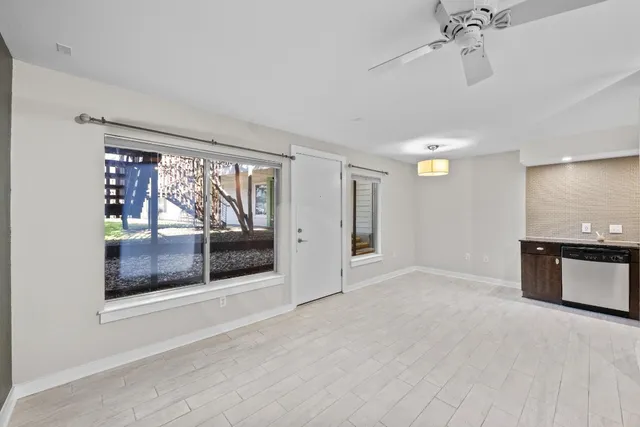 a view of an empty room with a window