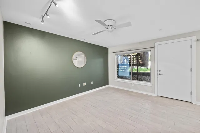 a view of an empty room with a window