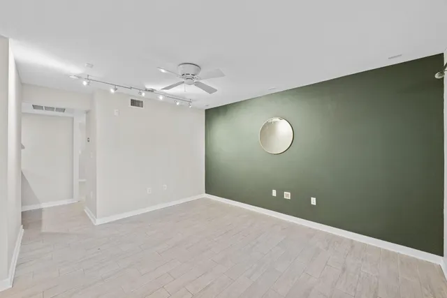 a view of a room with a fan