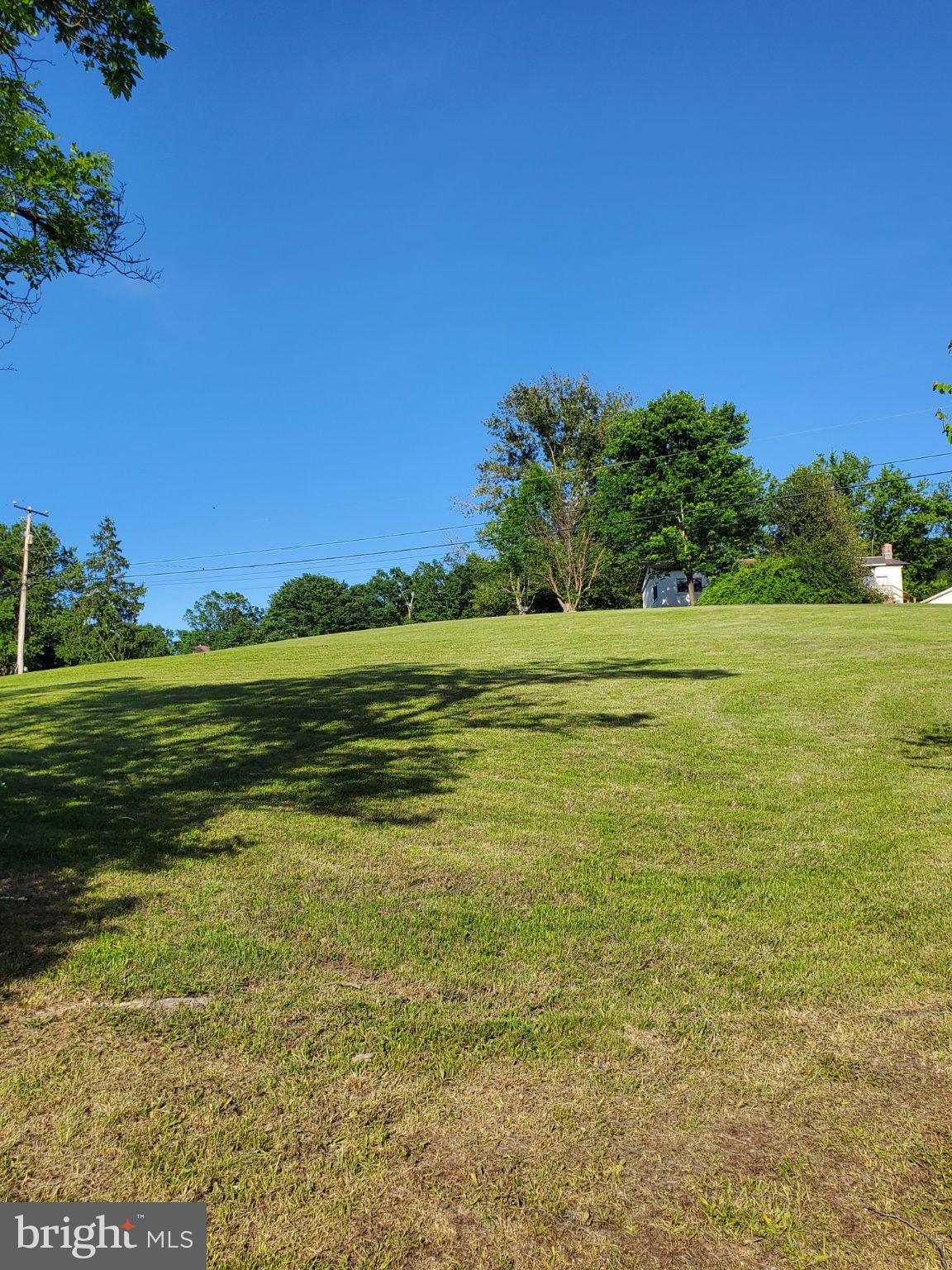 7881 Ford Hill Road Rio, WV 26755 - Photo 26 of 27 Serene hillside under clear skies.