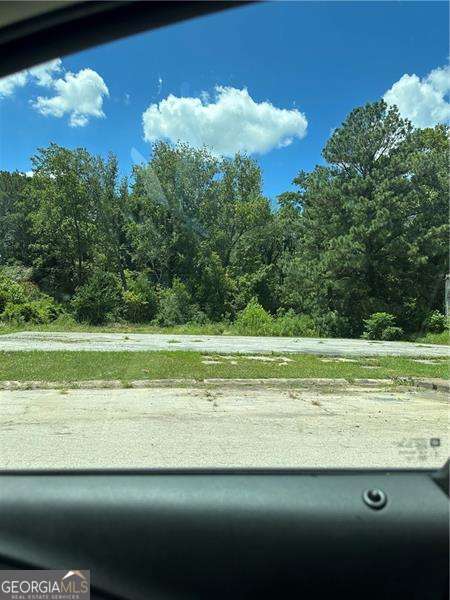 6625 Old Singleton Lane Clarkston, GA 30021 - Photo 5 of 5 a view of a golf course with a lake
