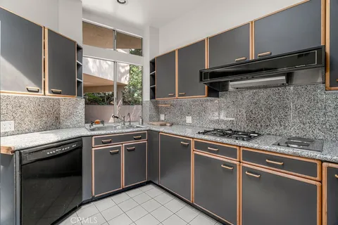 a living room with fireplace furniture and a large window