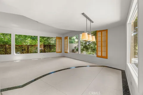 a bathroom with a granite countertop sink a mirror and a shower