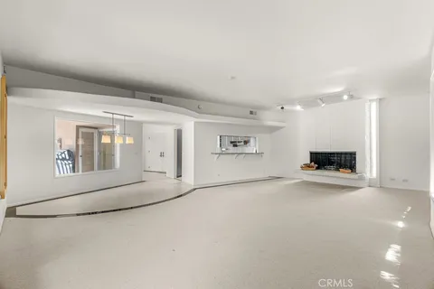 a bedroom with a bed and a cabinet