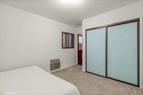 a bathroom with a granite countertop shower a toilet and a sink