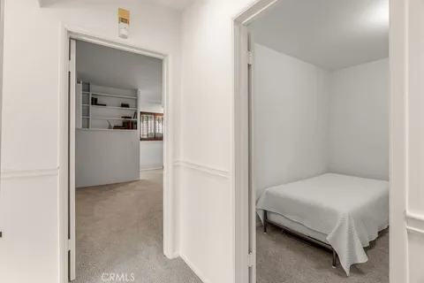 a white bath tub sitting in a bathroom next to a window