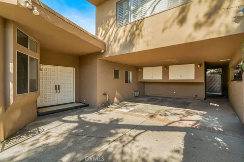 a view of backyard with a large tree