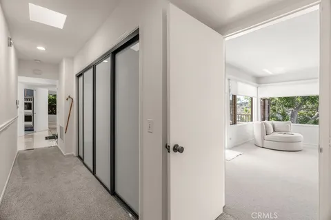 a room with pool table and windows